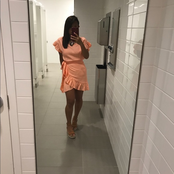 Vici Dresses & Skirts - Ruffle wrap dress in Peach color
